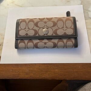Coach Signature Brown and Tan fold over wallet.